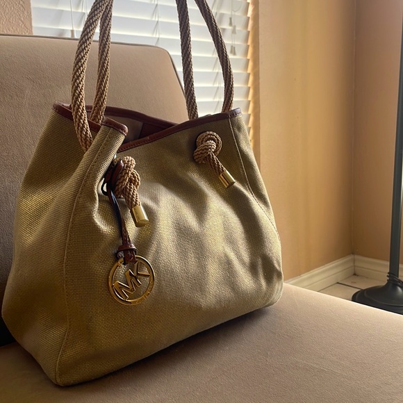 Gently used Gold canvas Michaels Kors bag. - Picture 2 of 6